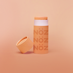 Load image into Gallery viewer, Nöz reef-safe sunscreen stick in orange.
