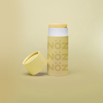 Load image into Gallery viewer, Nöz reef-safe sunscreen stick in yellow.
